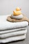 Wellness, white towels with pumice stone, peeling glove and rubber duck