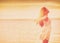 Wellness woman feeling free with open arms in freedom side profile silhouette on ocean beach background. Stress free
