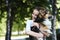 Welsh Corgi Pembroke dog and smiling happy woman together in a park outdoors.