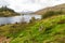 Welsh lake Llynnau Mymbyr from Capel Curig, grass in foreground