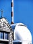 Wendelstein, Germany - telecommunication 5g antenna and cross chapel on blue sky background