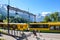 Wengen, Switzerland - July 16 2019: Platform on the main train station in Swiss Alpine village Wengen. Beautiful Alps with snow on