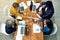 Were all in agreement here. High angle shot of a team of creatives shaking hands with each other across a table.