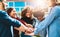 Were better together. a diverse group of college friends standing outside with their hands in a huddle.