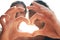 Were feeling lovely on this island today. Cropped shot of an unrecognizable couple making a heart shape with their hands