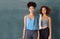 Were focused on fitness. Studio portrait of two young women after yoga class against a grey background.