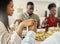 Were grateful for this moment. Shot of a group of friends saying grace before eating a meal together.