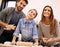 Were making dinner as a team. Portrait of a happy family of three baking together in the kitchen.