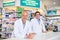 Were more than happy to serve your healthcare needs. Portrait of two male pharmacists working in a chemist.