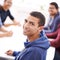 When were on the project, success is guaranteed. Portrait of a happy young man sitting in a meeting with his colleagues.