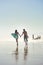 Were ready to surf on. a young couple spending the day at the beach with their surfboards.