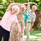 Were seniors and up for anything. a group of smiling seniors exercising outside.