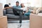 Were settling in quite well. Full length shot of a young couple sitting on the sofa in their new home.