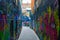 Werregarenstraat Graffiti Street in Ghent, Belgium, Europe, with defocused background with a person on a bike. Colorful famous