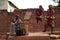 West African Children Filling Up A Water Bucket At The Borehole