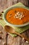 West African peanut soup with kale closeup on a table. vertical