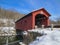 West Arlington Covered Bridge in a winter landscape in Vermont