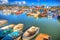 West Bay harbour Dorset UK boats on calm summer day