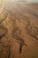 Western Australia â€“ sandy beach at low tide with water channels in the morning sun