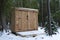 Western Cedar Storage Shed in Winter Forest