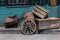 Western Chariot s Wheel, Wooden Wheelbarrow, Cask and Boxes in the Street