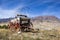 Western covered wood wagon mountains