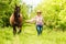 Western cowgirl woman with horse. Sport activity