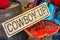 Western decor with Cowboy up sign and painted red vintage tractor seat