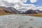 Western Mongolia mountainous landscape. View at Tsaagan Gol River, White River. Altai Tavan Bogd National Park, Bayan-Ulgii