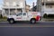 A Western Pest Services truck parked at the side of a street in front of several houses