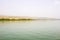 The western shore of the Sea of Galilee taken from a boat.