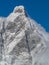 Western side of the Matterhorn mountain with snow flags in the windy winter weather