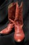 Western Style Red Cowgirl/Cowboy Boots with a Black Background