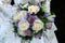 Western wedding dress and purple wedding bouquet