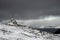 Westfjords of Iceland summit cross covered in snow