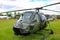 Westland scout helicopter parked on grass at military show