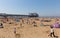 Weston-super-mare beach and pier busy with families on the beautiful May bank holiday weekend