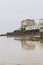 Weston super mare England reflections of sea front building on the low tide