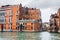Wet apartment buildings in Venice in autumn rain