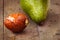 Wet avocado core on brown wooden old table