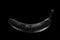 Wet Black banana with water drops on a dark background. Minimalist concept photography