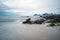 Wet boulders and rocks on beach in Lofoten islands during sunset and blue hours in spring. Long exposure photography.