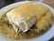 Wet Burrito with Green Sauce and cheese on top