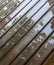 Wet cottage deck. Reflections in puddles on wooden planks after summer rain