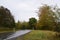 wet county road curve during autumn