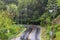 A wet curve road on heavy raining day