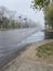 Wet foggy asphalt road after spring rain