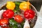 Wet fresh juicy vegetables in a metal bowl with overflowing water.