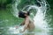 Wet hair and beard. Freedom summer concept. Carefree and positive thinking. Bearded man splashing water by hair. Summer