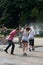 Wet happy teenagers at a water fight in Herastrau park